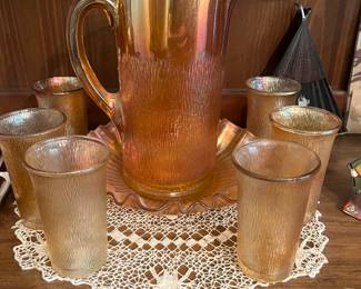Jeanette tree bark marigold carnival glass pitcher and glasses