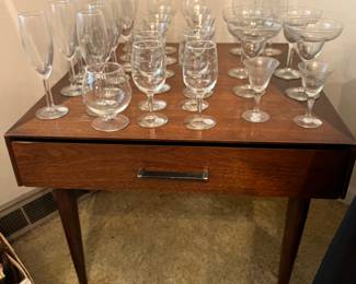 assorted crystal stemware - mid century side table