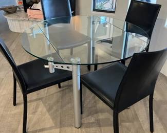 Glass table with 4 leather chairs