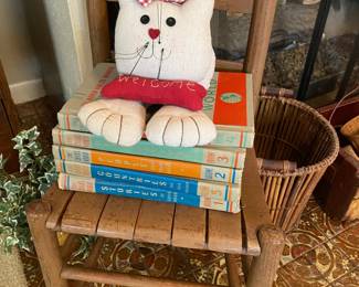 Childs chair, books and cat decoratives