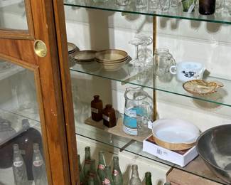 Antique and vintage bottles and shot glass and also some liquor decanters 