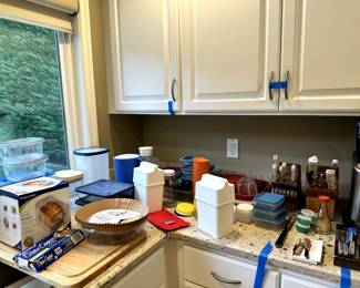 Various Tupperware and steak knives