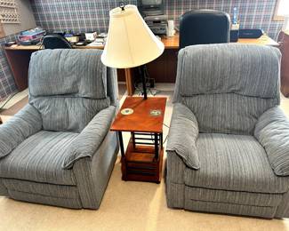 (2) grey recliners and sidetable with mounted lamp