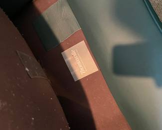 $200 Thomasville green leather style club chair with 
ottoman