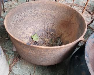 RO122 - $100. Large Cast Iron Pot has holes drilled holes. 