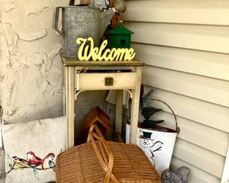 Side table 
Picnic basket 
Old metal watering can 