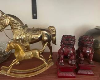 Brass rocking horses and Foo dogs.