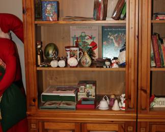 two lighted solid-wood display cabinets/bookshelves