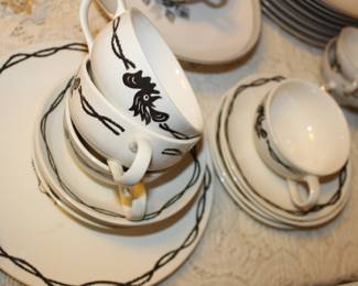 set four cups and saucers, and four cake plates