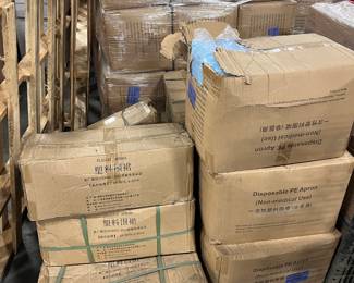 Cases of medical isolation gowns in blue