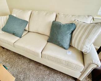 Gorgeous Benchcraft  linen 7-foot sofa in perfect condition. Throw pillows included 