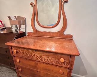Antique 3-drawer dresser with unique mirror attached. 