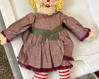 This handmade Raggedy Ann doll was made in the 1940s. She is in her original clothing and waiting for her new home. 