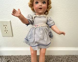 Made from molded composition in the 1930s. Original clothing (and yes she blinks) 