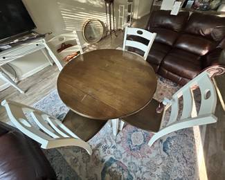 Ashley Furniture Woodanville Dining table and 4 chairs. It has leaves on 2 sides 