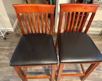 Come and get these counter-high bar stools. They’re versatile and match most any decor 