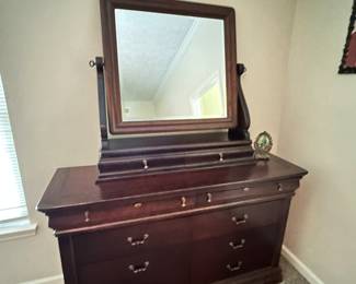 This stunning dresser is actually 2 pieces. The mirror/double drawer section lifts off to help when you take it home. Lots of space in these drawers too 