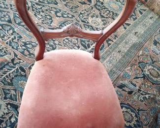 Rose seated chair antique from England.
Good view of the huge oriental carpet for sale.