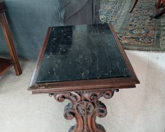 Antique side table with black marble and intricate.
A more distant view of the beautiful design of the Persian rug, Sarouk design (16ft x 20ft approx) purchased in 1963 in London England.