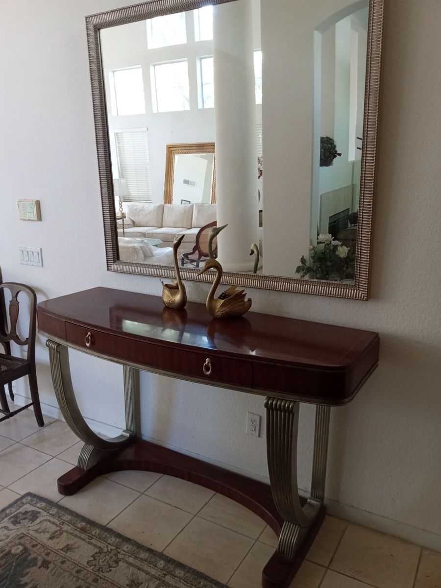 Lovely mahogany entry table matching mirror,  silver accents.