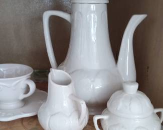 Lovely leaf design on creamer sugar and teapot.