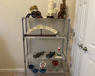 Shelving with plastic reproduction oriental figures