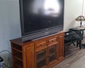 Super huge rear projector TV
1990's . $100, 
Solid wood cabinet underneath
Multi storage capacity $250