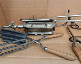 The one in the back on left is a very cool turn of the century gas heated base for a hair curling iron  ( comes with the curing iron $100)