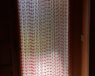 Beaded curtain for doorway.