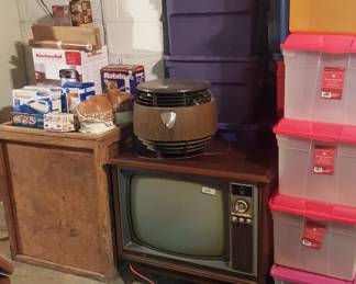 early 1970's color t v, hassock fan (works), storage totes, wood shipping crate and kitchen items still in the box.