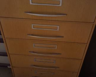 Mc Call's metal pattern cabinet full of patterns . 