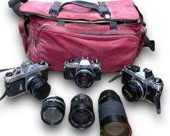 Huge lot of x3 35mm Film Cameras And Accessories Including: A Nikon FG 35mm Camera w/ A Nikon Series E 50mm F/1.8 Lens, A Honeywell Pentax Spotmatic 35mm SLR Film Camera w/ A Asahi Super-Takumar 1:1.8/55mm Lens, Nikon FE2 Silver 35mm SLR Film Camera w/ A Nikon E Series 50mm 1:1.8 Lens, A Nikon NIKKOR 28mm f/2.8 E Series Lens, ProMaster Spectrum 7 lens 35-200mm 3.8-5.3 macro
