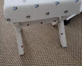 Foot stool with bees and bugs. 
