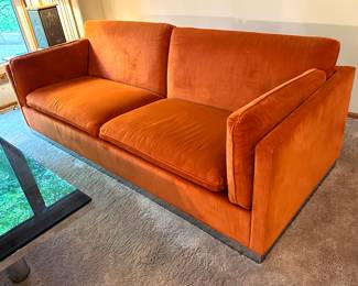 Vintage Mid Century Modern Jack Cartwright Sofa. Wow! This is an amazing mid century sofa in very good condition. 

Features luxurious clean orange upholstered seating paired with a chrome platform base. 

Measures 82.5" x 34.5". 