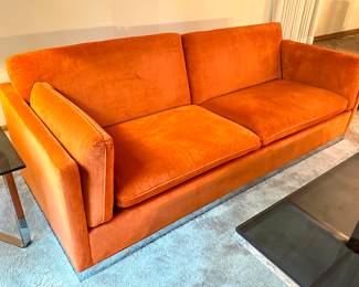 Vintage Mid Century Modern Jack Cartwright Sofa. Wow! This is an amazing mid century sofa in very good condition. 

Features luxurious clean orange upholstered seating paired with a chrome platform base. 

Measures 82.5" x 34.5". 