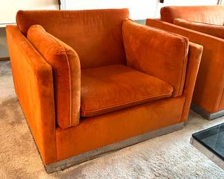 Pair of Mid Century Modern Jack Cartwright Chairs upholstered in a fantastic retro orange shade paired with a chrome base.  Each measuring about 37” x 34.5”. 

Items in vintage condition with some light wear including one having some wear to the fabric on the edges