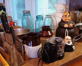 Assorted kitchenware including blue canning jars, and a McCoy cookie jar