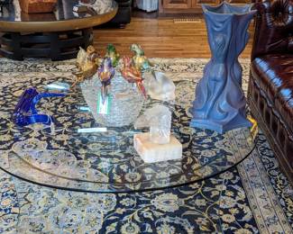 Contemporary two-piece glass coffee table, large Von Briggle "Three Graces" vase, Lalique reclining cat, Czechoslovakian frosted glass eagle hood ornament, fantastic artist-signed Murano glass bird bowl and Chihuly-style twisted glass tube. 