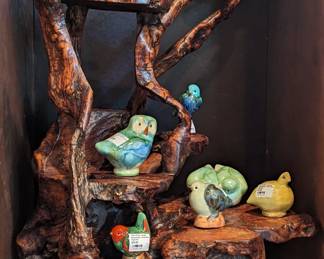 Wonderful burl wood stump, with collection of Wolf Pottery Studio (Mississippi) bird figurines.