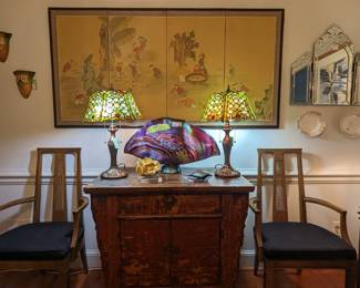 Vintage Asian wood chest, with pair of Tiffany-style stained glass table lamps, metal magnolia blossom on glass base, custom dichoric and cane glass sea fan, by James Nowak, 4-panel hand-painted Asian screen, Italian Venetian wall mirror and pair of vintage Roseville wall pockets.
