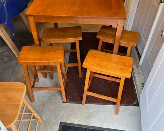 Bar height table with 4 stools.