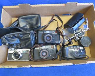 Lot 50. 35MM Point and Shoot Cameras and Lens Attachments