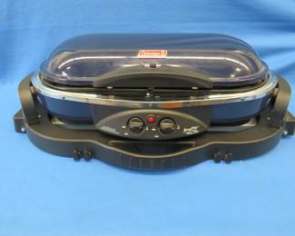 Lot 91. Coleman Road Trip grill.&nbsp; 9941 Series propane stove.&nbsp; Owner states used once.&nbsp; Adjustable height legs.
