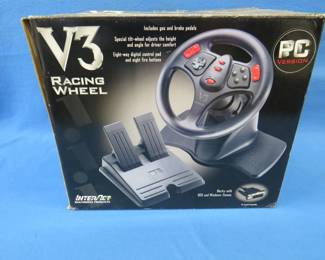 Lot 104. V3 racing wheel.&nbsp; Includes gas and brake pedals.