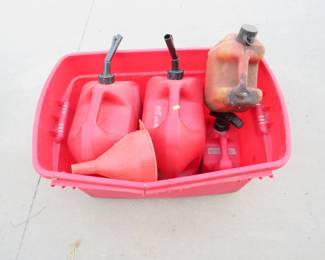 Lot 151. Four Plastic Gas Cans and Tote