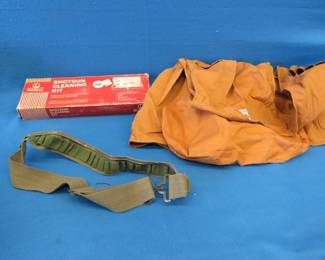 Lot 182. Hunting vest, shell belt, and a likely never used shotgun cleaning kit