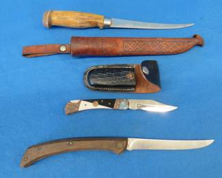 Lot 217. Rapala fillet knife, Chicago Cutlery knife, and a folding knife with a sheath