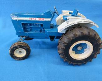 Lot 280. Die-cast Ford tractor with a broken wheel