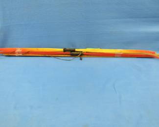 Lot 290. Three fiberglass bows and three yardsticks