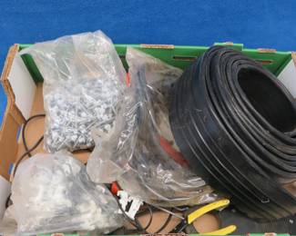 Lot 293. Garden edge, peg board clips, metal roof screws, and more